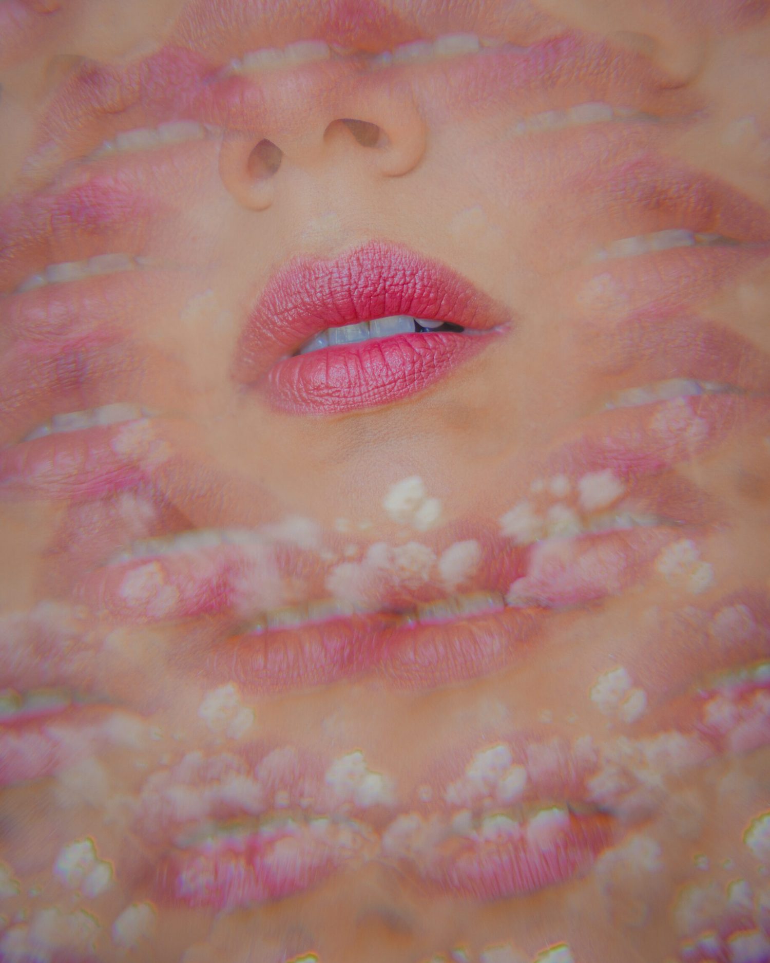 prismatic photo of a pinkish red lipstick worn by a woman including white flowers as part of the beauty photography at Minuit Studios a French photographer based in Houston texas and traveling around the world
